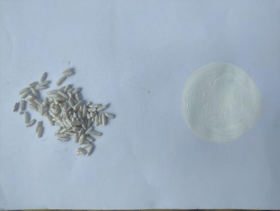 Grains of puffed rice beside a soft chalk-white swatch.