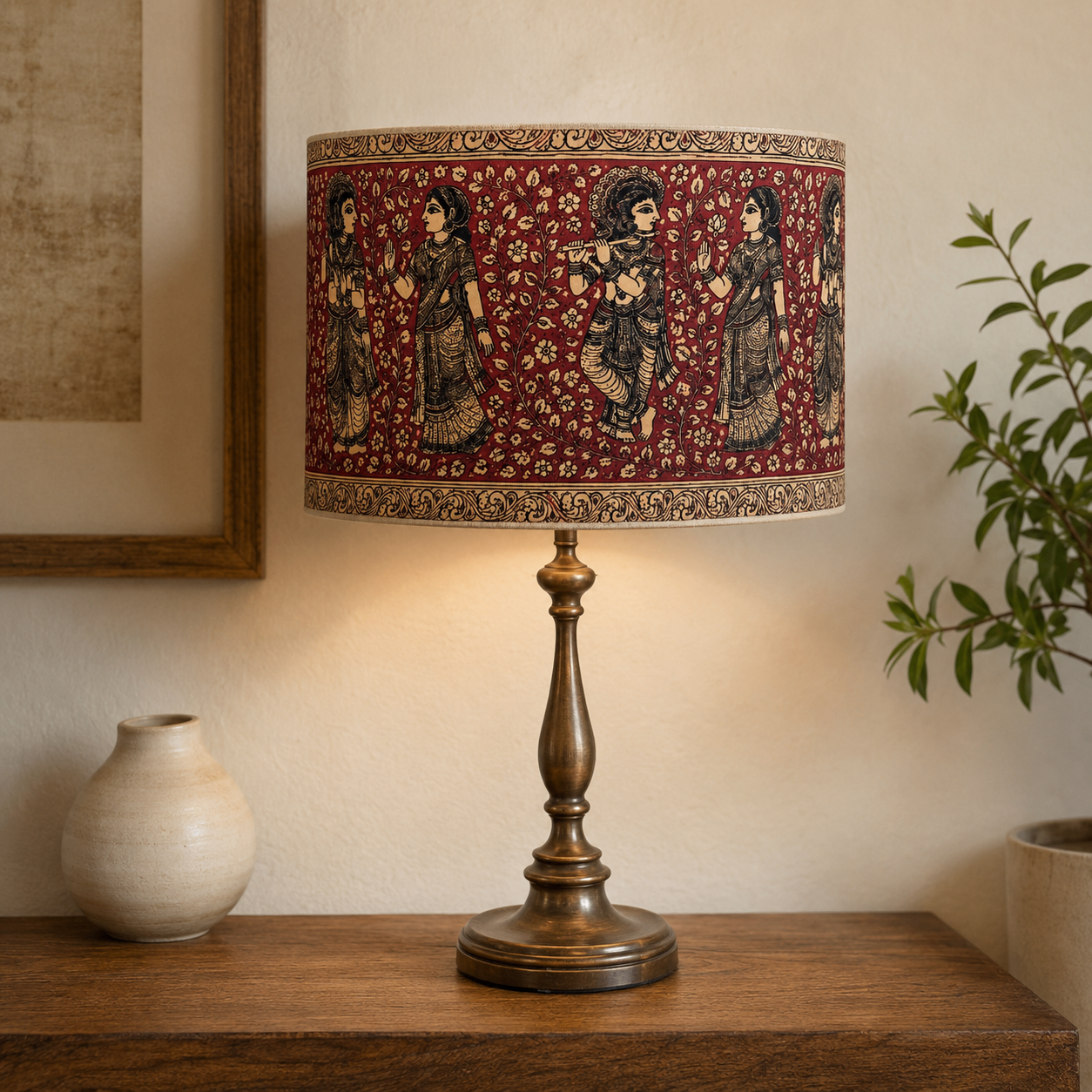 A hand-painted Varnya lampshade with Krishna and gopi figures on a brass stand
