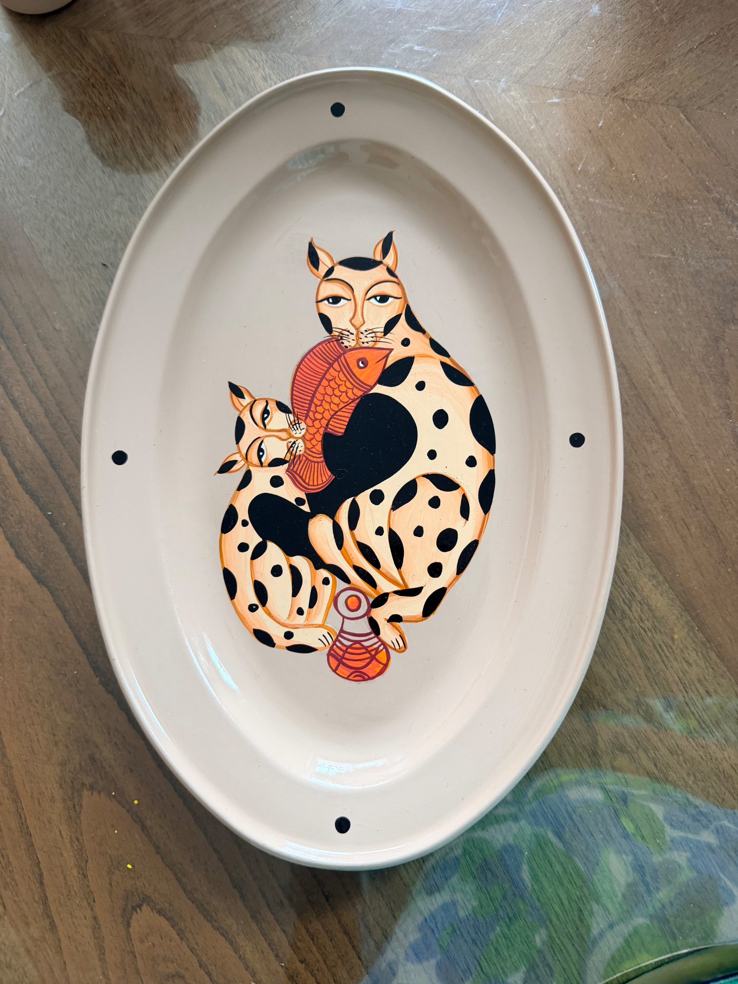 Kalighat Cat Family hand-painted oval steel tray photographed from above